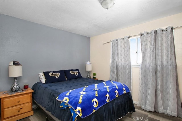 bedroom featuring hardwood / wood-style floors