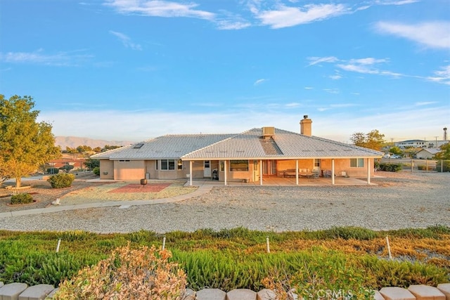 view of front of house with a patio