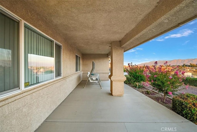 view of patio / terrace featuring a mountain view