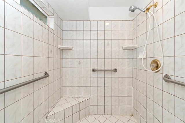 full bathroom with a tile shower