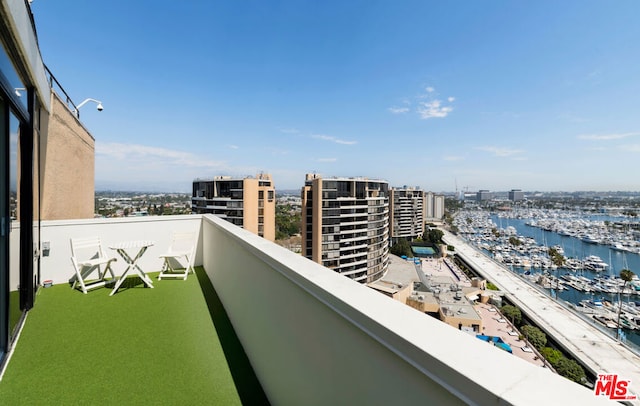 balcony featuring a water view