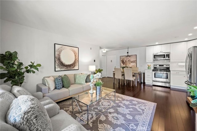 living room featuring dark wood-type flooring