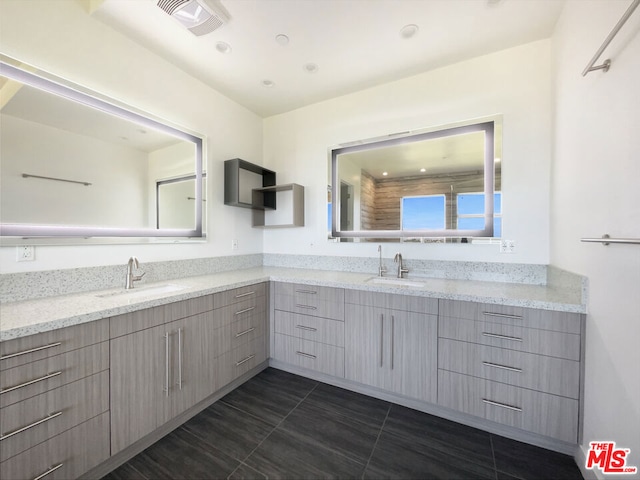 bathroom featuring tile patterned flooring and vanity