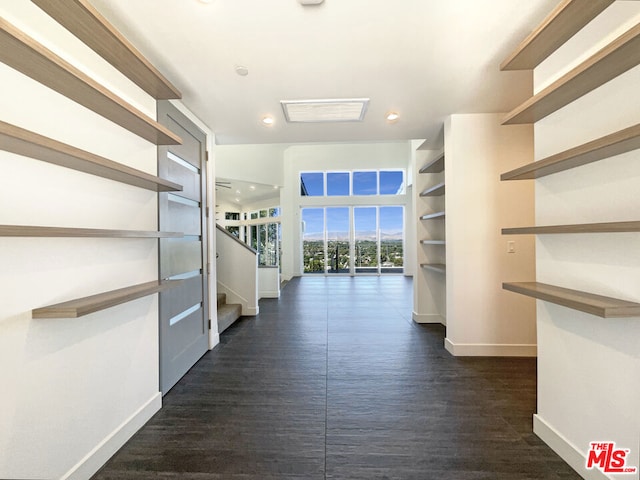 hallway with dark hardwood / wood-style floors