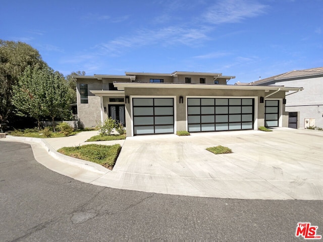 prairie-style home featuring a garage