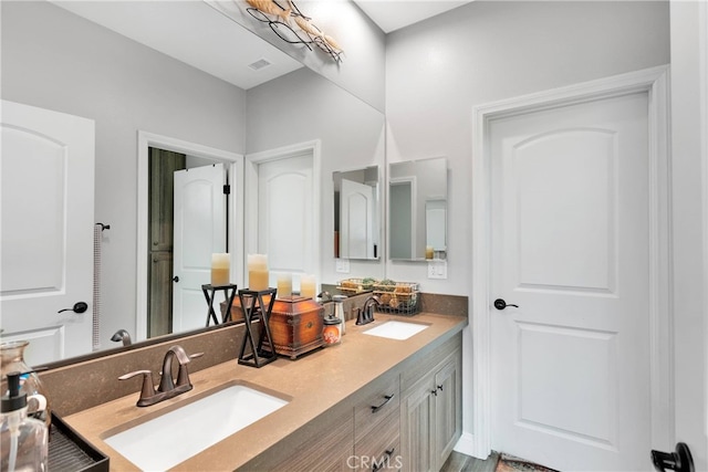 bathroom featuring vanity and hardwood / wood-style floors