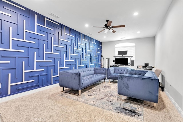 carpeted living room featuring ceiling fan