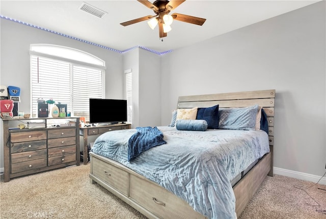 carpeted bedroom featuring ceiling fan