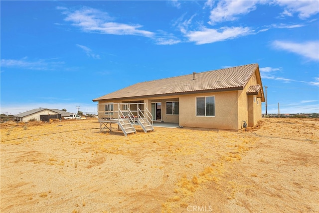 back of property featuring a patio area