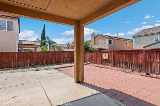 3688 Alhambra Ln, Perris, CA 92571 - fenced backyard with a patio area and a residential view