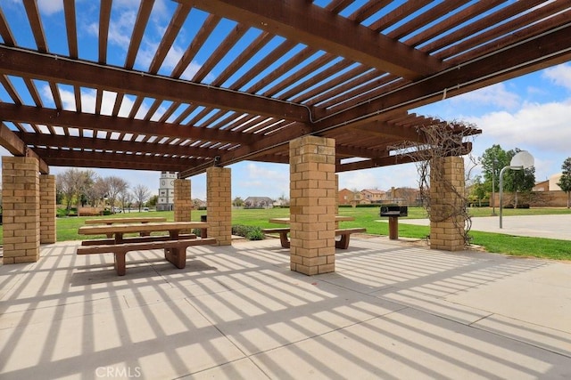 view of property's community featuring a patio area, a pergola, and a yard