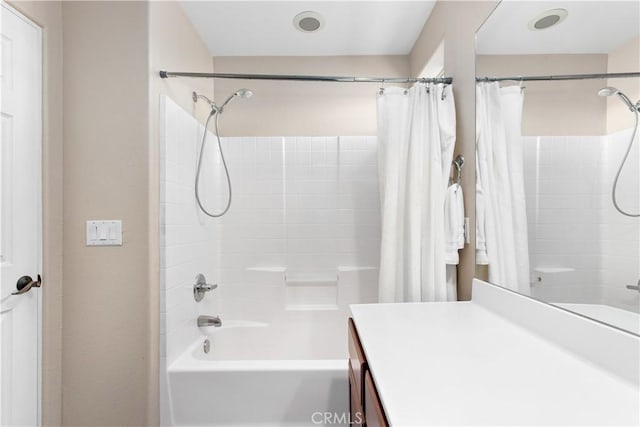 bathroom with vanity and shower / bathtub combination with curtain