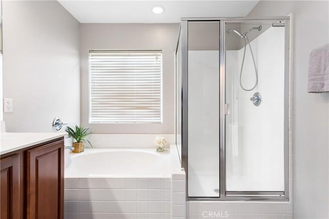 bathroom with plus walk in shower and vanity