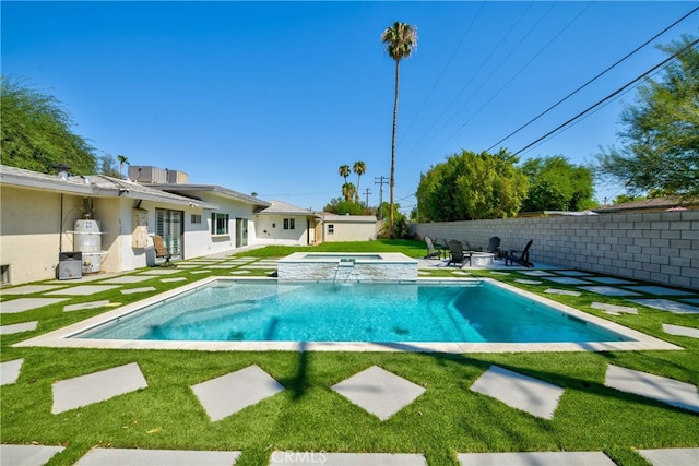 view of swimming pool with a patio, an in ground hot tub, and a lawn