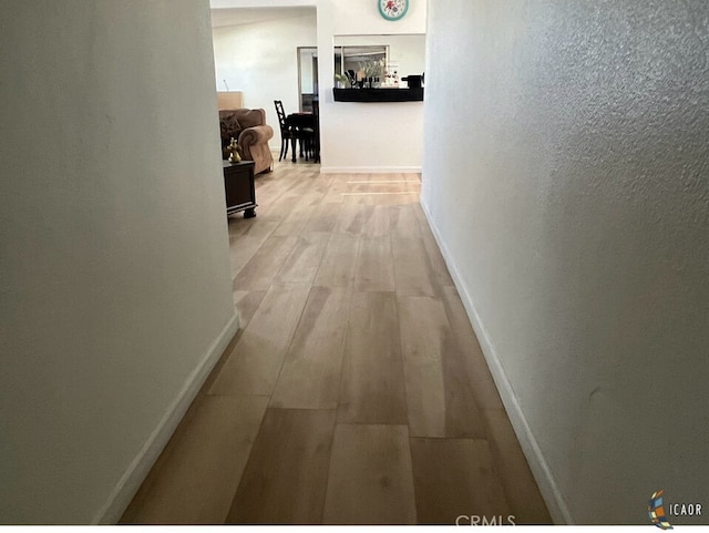 hallway featuring light wood-type flooring