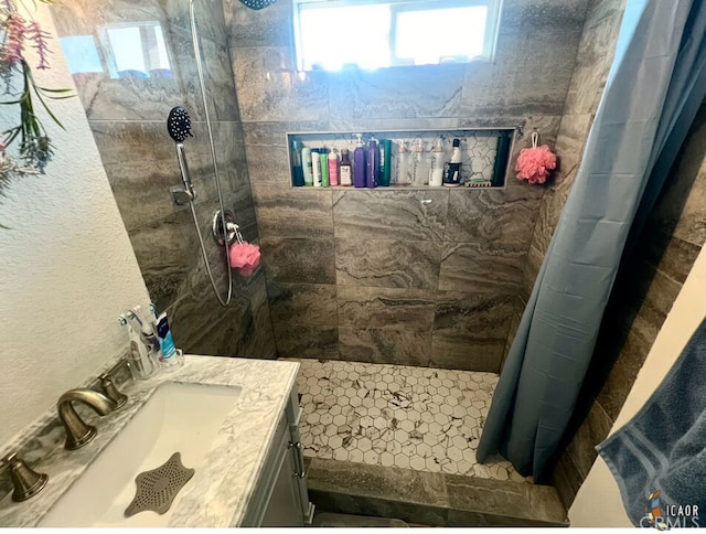 bathroom with vanity and walk in shower