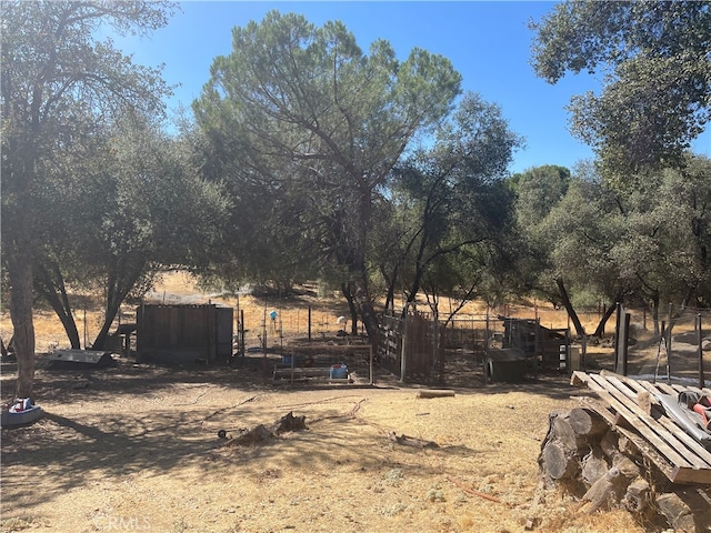 view of yard with a rural view