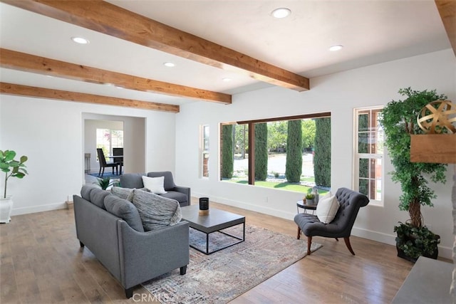 living room with beamed ceiling and hardwood / wood-style flooring