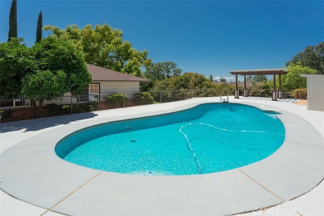 view of swimming pool with a patio area