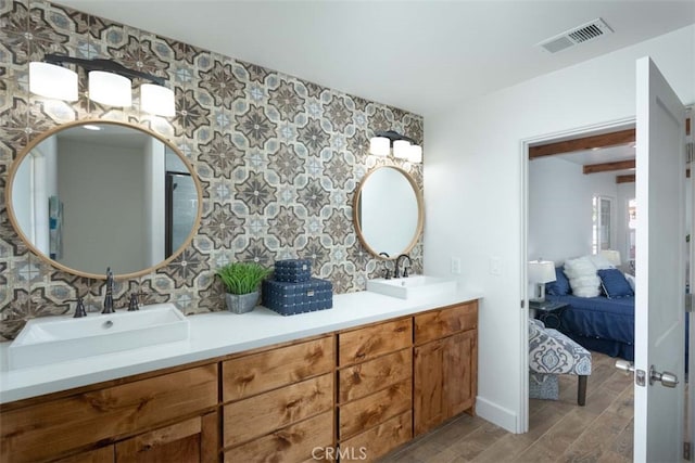 bathroom with vanity and hardwood / wood-style flooring