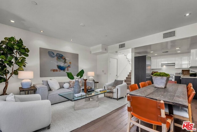 living room with dark hardwood / wood-style floors