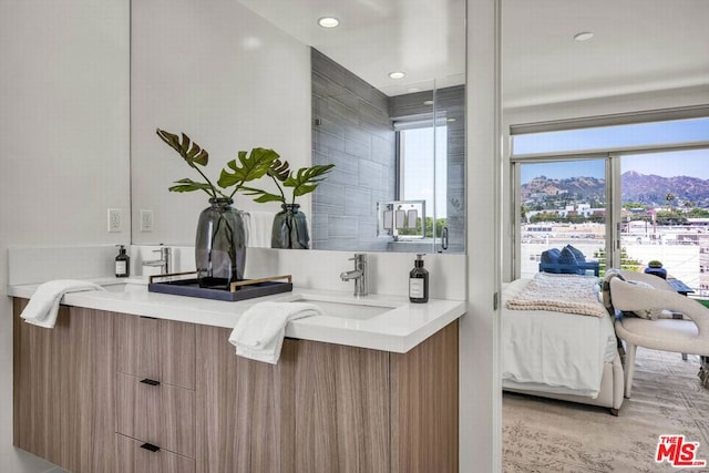 bathroom with a mountain view and vanity