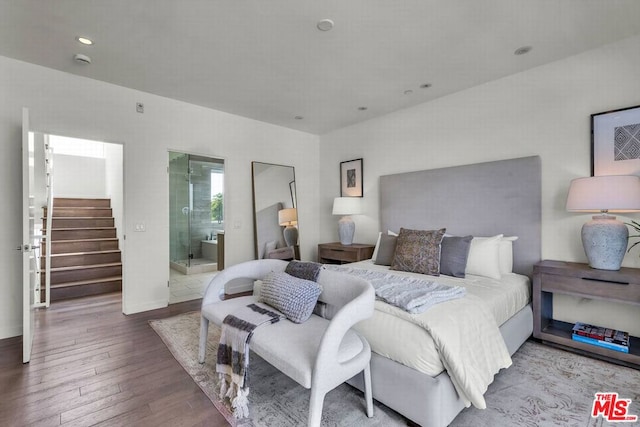 bedroom featuring hardwood / wood-style floors and ensuite bath