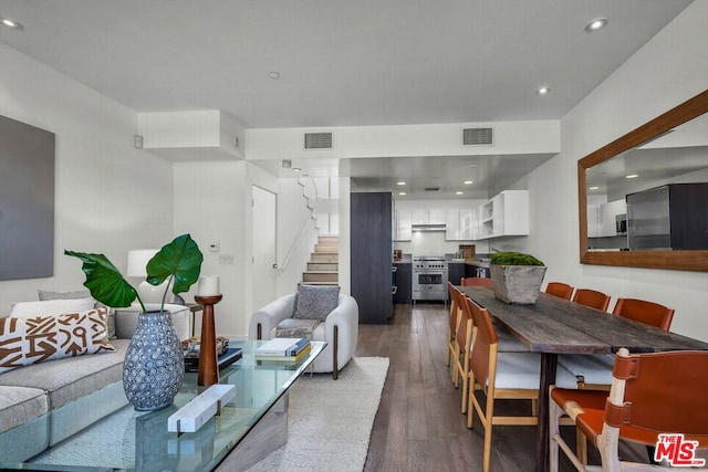 living room featuring dark wood-type flooring