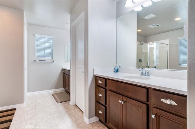 bathroom with vanity and an enclosed shower