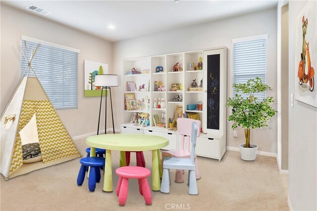 playroom featuring light carpet