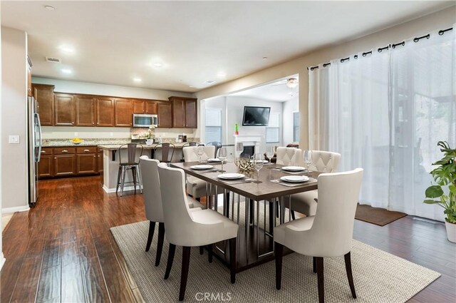 dining area featuring dark hardwood / wood-style floors