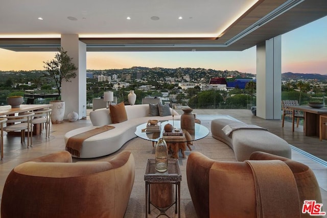 living room featuring a tray ceiling