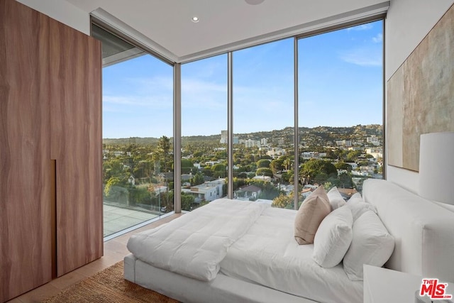 bedroom featuring floor to ceiling windows