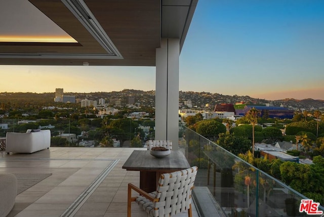 view of balcony at dusk