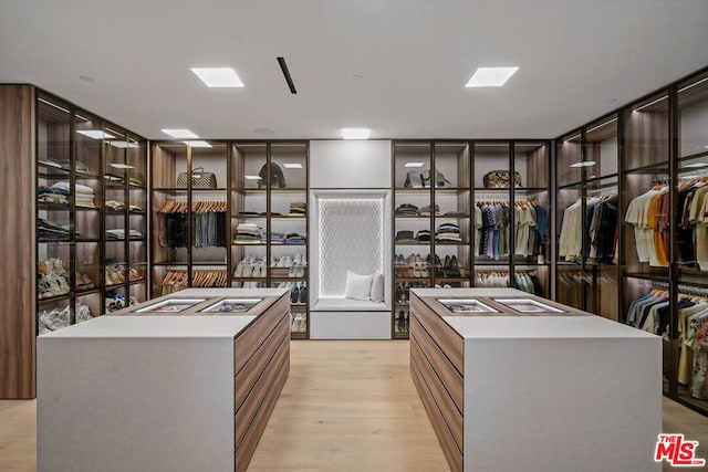 walk in closet featuring light wood-type flooring