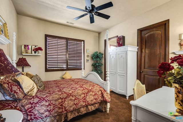 bedroom featuring ceiling fan and dark colored carpet