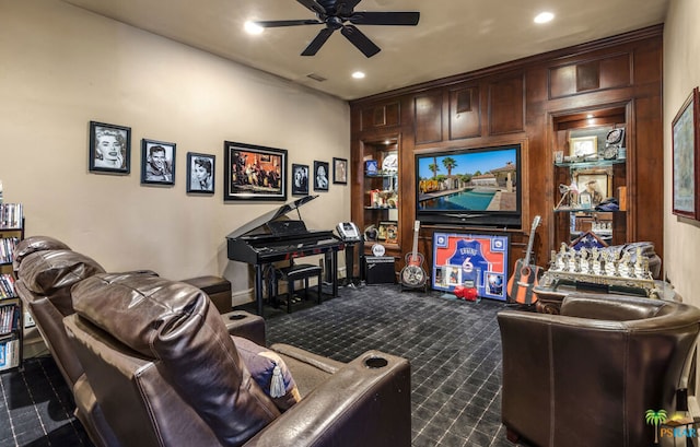 carpeted living room featuring ceiling fan