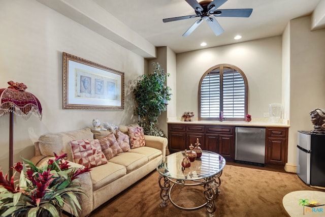 living room with light carpet and ceiling fan