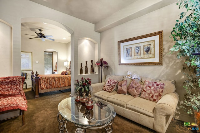 living room with dark carpet and ceiling fan