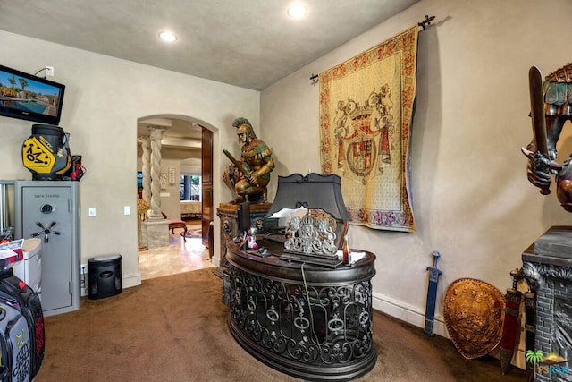 miscellaneous room featuring dark colored carpet and a fireplace