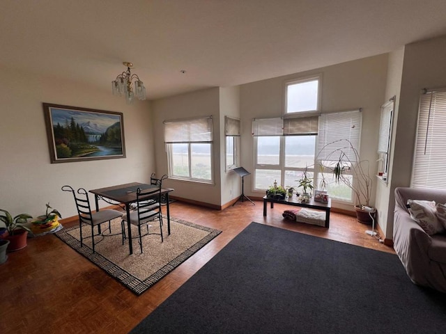 dining area featuring an inviting chandelier and light hardwood / wood-style flooring