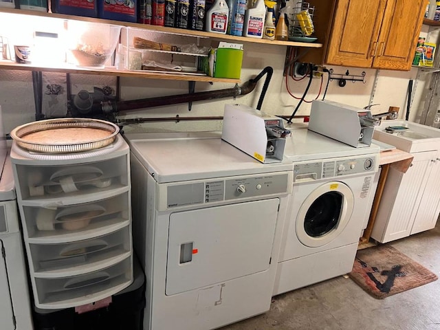 laundry room featuring cabinets, sink, and washing machine and dryer