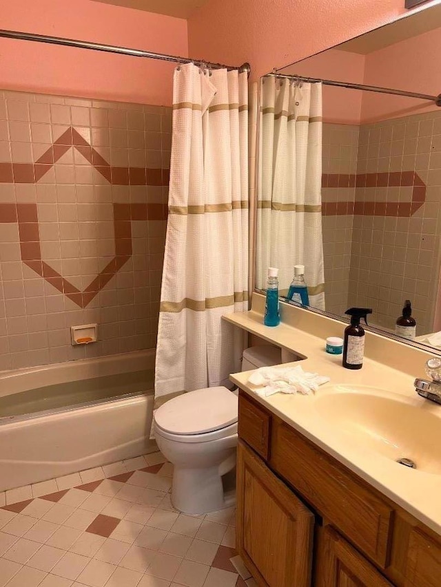 full bathroom with tile patterned flooring, shower / bath combo, vanity, and toilet