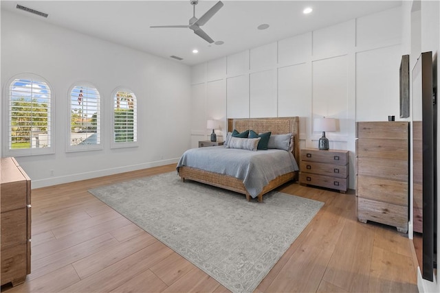 bedroom featuring ceiling fan and light hardwood / wood-style flooring