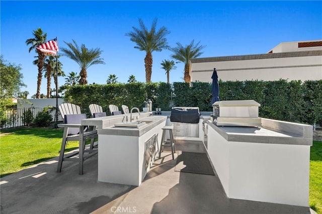 view of patio featuring an outdoor kitchen and a bar