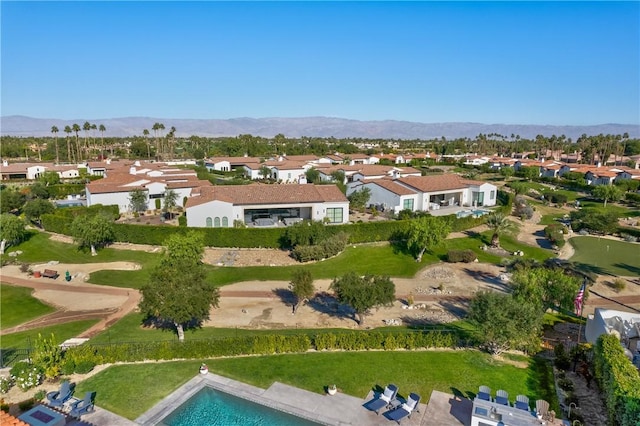 birds eye view of property featuring a mountain view