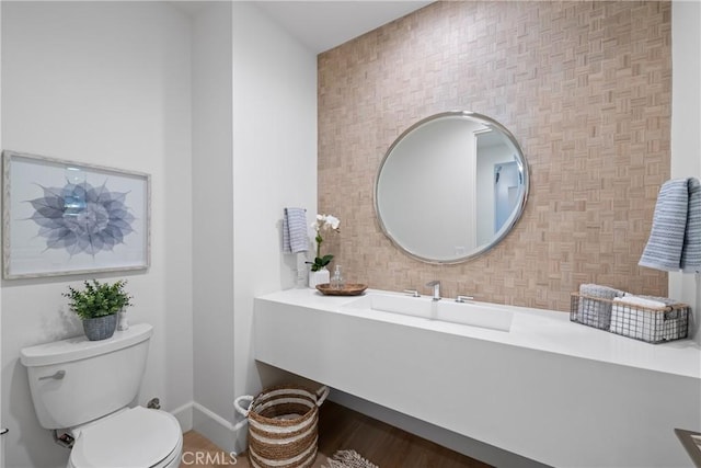 bathroom with vanity, hardwood / wood-style floors, and toilet