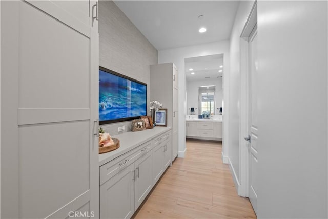 corridor featuring light hardwood / wood-style flooring