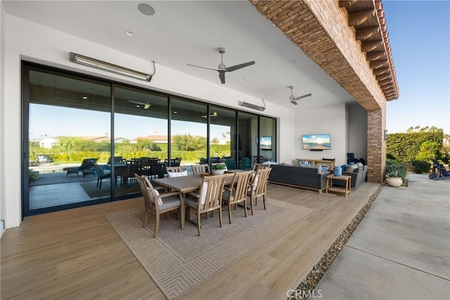 dining space with hardwood / wood-style flooring and ceiling fan