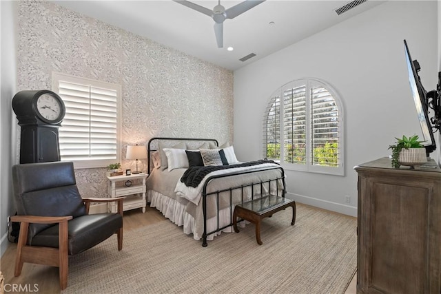 bedroom with ceiling fan and light wood-type flooring